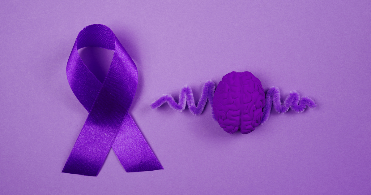 sintomi fibromialgia - immagine di un fiocco viola il simbolo della fibromialgia